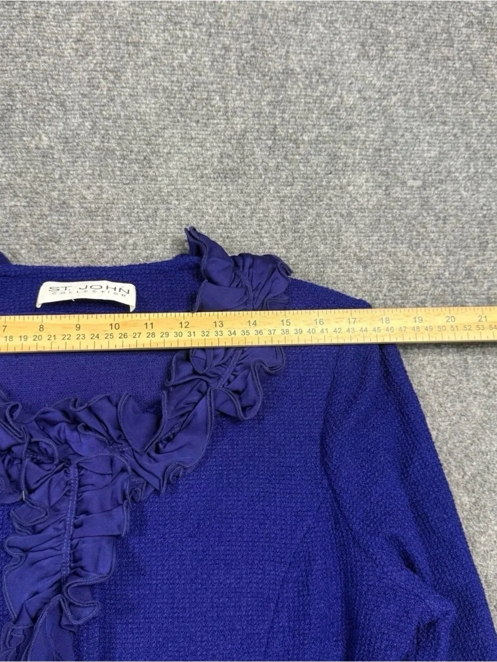 St. John Collection Blue knit skirt suit features a jacket Size 12